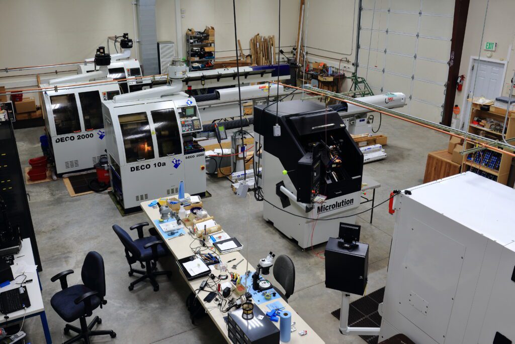 Factory workshop with machinery and workstations.